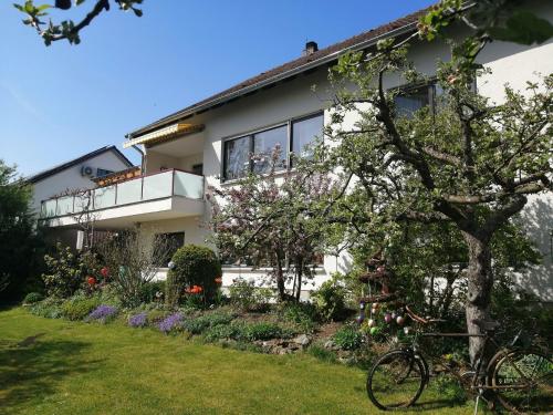 a house with a bike parked in front of it at Große Ferienwohnung In Sinbronn Mit Garten in Dinkelsbühl
