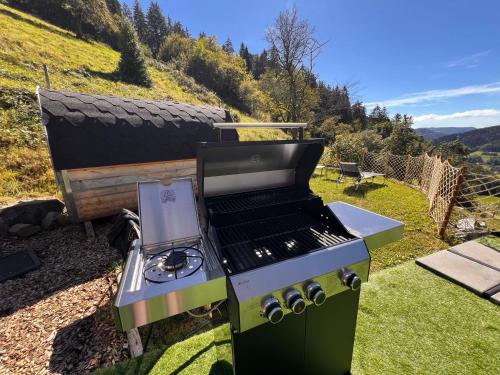 a gas grill sitting on top of a hill at Fewo Mit Whirlpool Und Fass Sauna Im Schwarzwald in Hausach