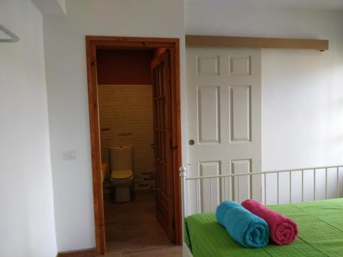 a bedroom with a bed with two pillows on it at Allotjament Bogues in Lloret de Mar
