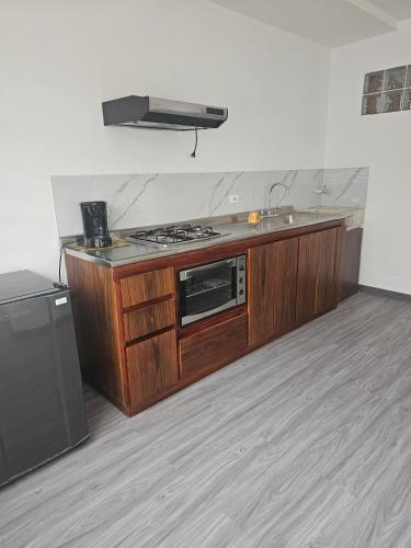 O bucătărie sau chicinetă la Apto Corferias