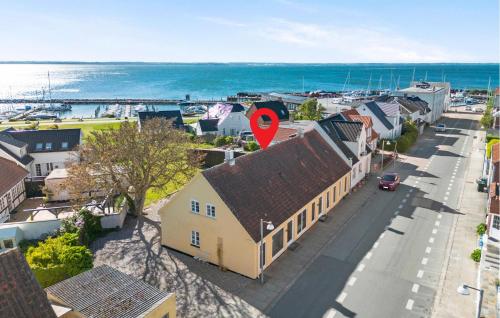 an aerial view of a town with a house and the ocean at Beautiful Apartment In Tranekær in Tranekær