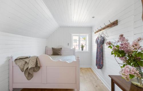 a white room with a bed and a window at Beautiful Apartment In Tranekær in Tranekær