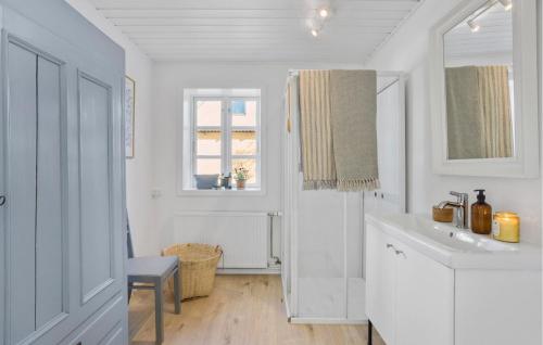 a white kitchen with a sink and a window at Beautiful Apartment In Tranekær in Tranekær