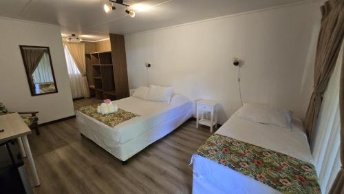 Postel nebo postele na pokoji v ubytování Hotel Hotu Matua by EI