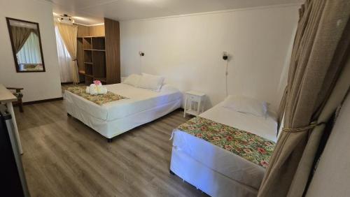 Postel nebo postele na pokoji v ubytování Hotel Hotu Matua by EI