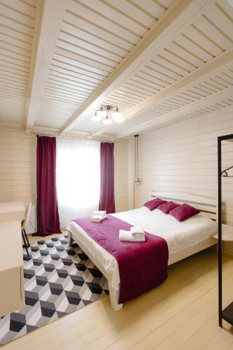 a bedroom with a large bed in a room at Вілла у горах in Krasnik
