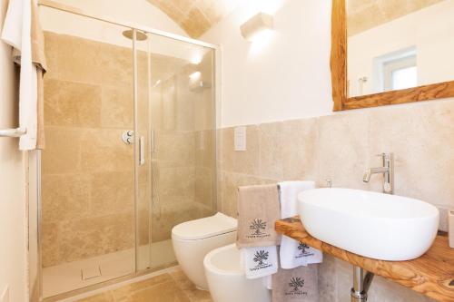 a bathroom with a shower and a sink and a toilet at Tenuta Mogavero in Torre Canne