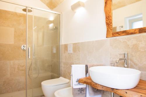 a bathroom with a sink and a shower and a toilet at Tenuta Mogavero in Torre Canne