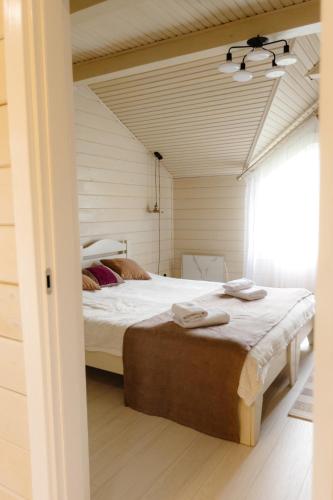a bedroom with a large bed in a room at Вілла у горах in Krasnik