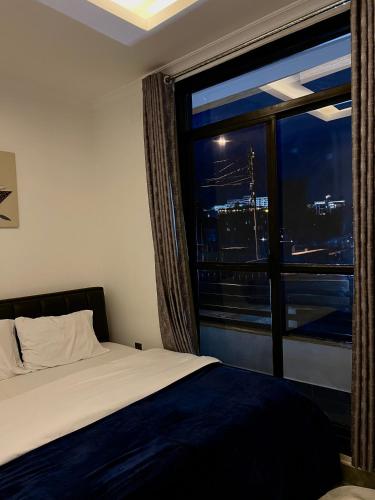 En eller flere senge i et værelse på CosyNook C 2Bedroom
