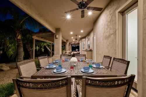 a dining room with a table and chairs at Northridge Mesa in Mesa