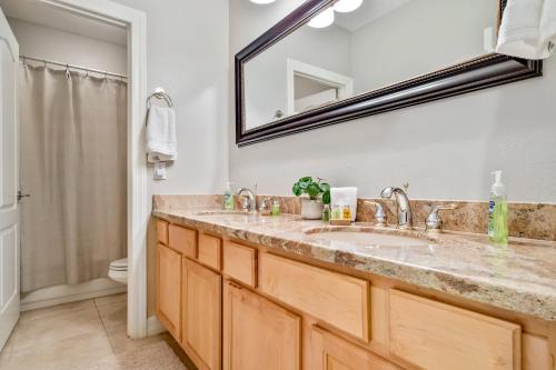 a bathroom with a sink and a mirror at Northridge Mesa in Mesa