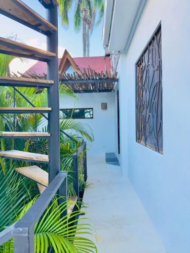 a hallway of a house with palm trees at Soul Dream Bonita in Las Terrenas
