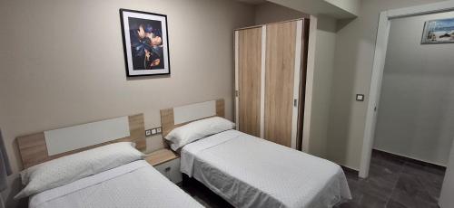 Postel nebo postele na pokoji v ubytování Apartamentos solymar oropesa del mar