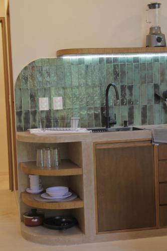 a kitchen with a sink and a counter top at Minimalist Verde Chapu in Guadalajara