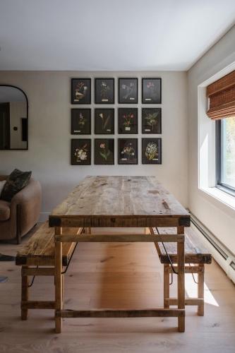 a wooden table in a living room with a table sidx sidx sidx at The Bend in Phoenicia