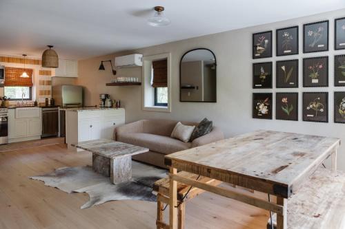a living room with a table and a couch at The Bend in Phoenicia