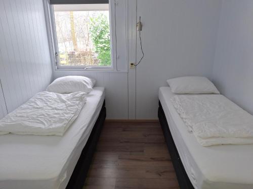 Postel nebo postele na pokoji v ubytování Molkenbos Terschelling