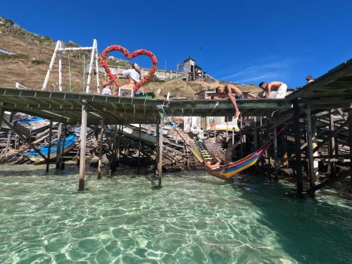 a water park with slides and swings in the water at Pousada Kundalini Arraial in Arraial do Cabo