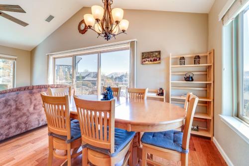 a dining room with a table and chairs and a window at Furnished Deck and Gas Grill South Lake Tahoe Home! in South Lake Tahoe
