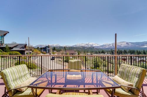 a patio with a glass table and chairs on a balcony at Furnished Deck and Gas Grill South Lake Tahoe Home! in South Lake Tahoe