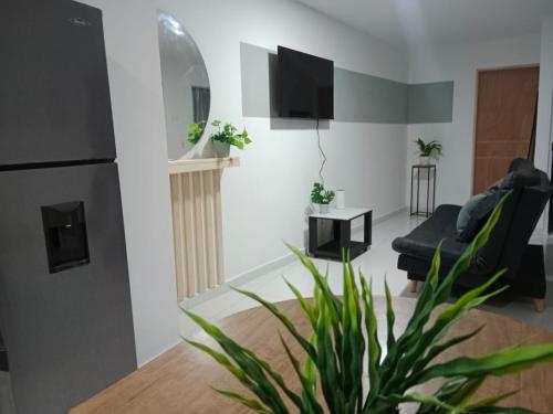 TV a/nebo společenská místnost v ubytování Hermoso e iluminado apartamento.