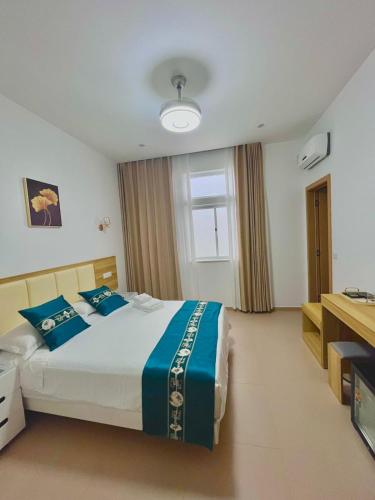 Кровать или кровати в номере Lily holiday hotel