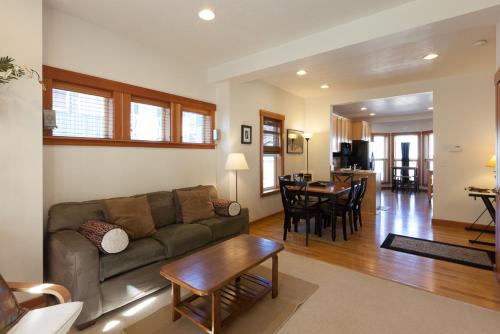 a living room with a couch and a table at Venturi 30 day minimum in Hood River