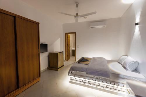 Ένα ή περισσότερα κρεβάτια σε δωμάτιο στο Pharaohs Guest House