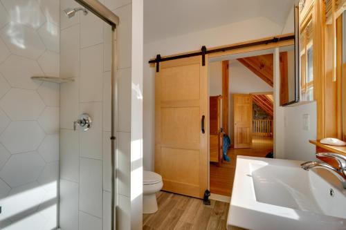 a bathroom with a shower and a sink and a toilet at Secluded Vermont Retreat Outdoor Pool and Deck in Stratton