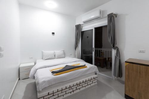 Ένα ή περισσότερα κρεβάτια σε δωμάτιο στο Pharaohs Guest House