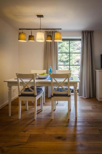 a dining room with a table and two chairs at Pension Kleiner König in Struppen-Siedlung