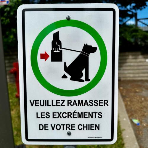 a sign with a dog on a leash rem petertodd less agreements at INITIAL - MOOSE - Chutes-Montmorency in Boischâtel