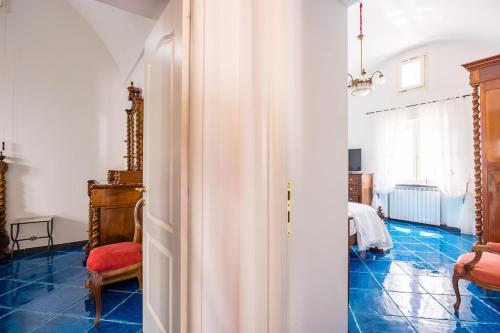 a hallway with a room with blue tile at Villa Antonella Amalfi Coast in Praiano