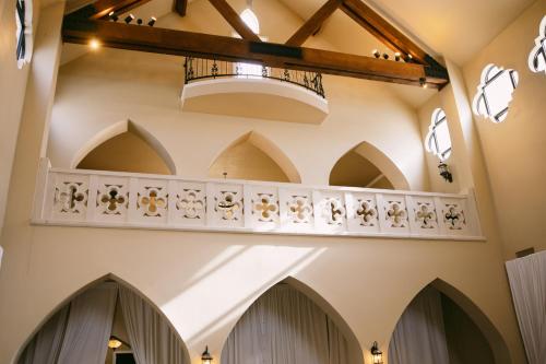 a view of the hallway of a church with a balcony at The Castle at Rockwall in Rockwall