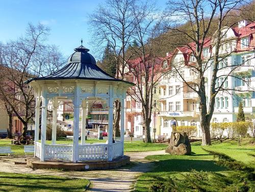 a gazebo in the middle of a park at Jáchymov Blue Apartment in Jáchymov