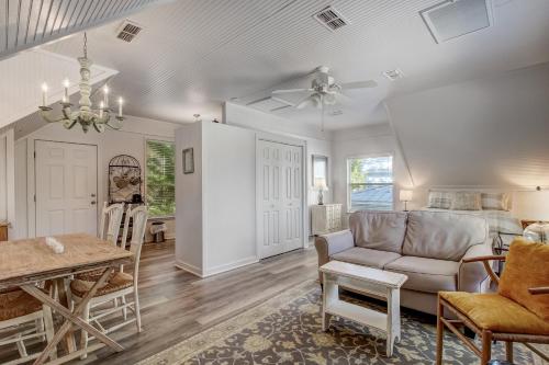 a living room with a couch and a table at Adorable Dog Friendly Garage Apartment in the Historic District of Old Town in Fernandina Beach