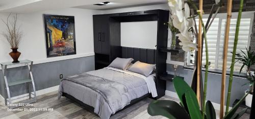 a bedroom with a bed and a window at Staycation Oasis! a unique Experience! Heated pool open until October 31st in Easton