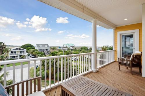 a balcony with a view of the ocean at Oceanfront w Pool Panoramic Deck Views 5BDR Folly Ocean Breeze by AvantStay in Folly Beach
