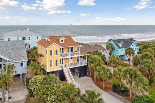 an aerial view of a house with the beach at Oceanfront w Pool Panoramic Deck Views 5BDR Folly Ocean Breeze by AvantStay in Folly Beach