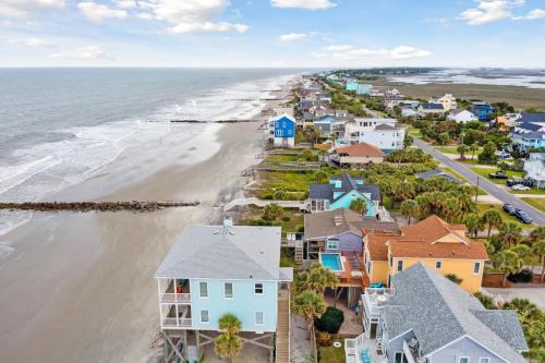 an aerial view of a beach with houses at Oceanfront w Pool Panoramic Deck Views 5BDR Folly Ocean Breeze by AvantStay in Folly Beach