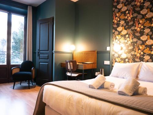 Posteľ alebo postele v izbe v ubytovaní Hôtel Gallia