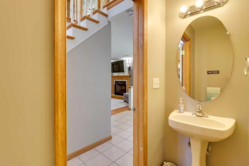 a bathroom with a sink and a mirror at Deck, Game Room and Fire Pit Poconos Retreat in Albrightsville