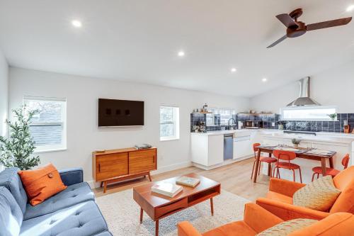 a living room with a couch and a table at Less Than 1 Block to City Park New-Build Apt in Denver! in Denver