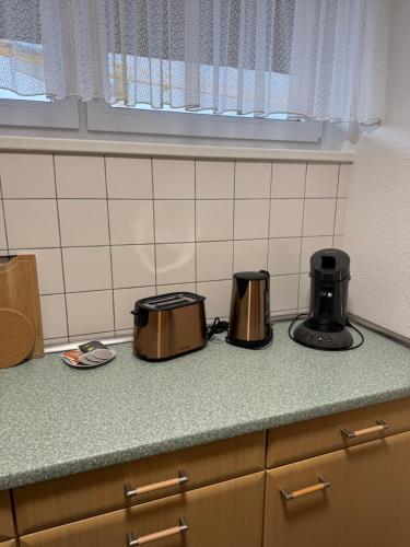 a kitchen counter with two toasters on a counter top at Penthouse Central Apartment in Marl