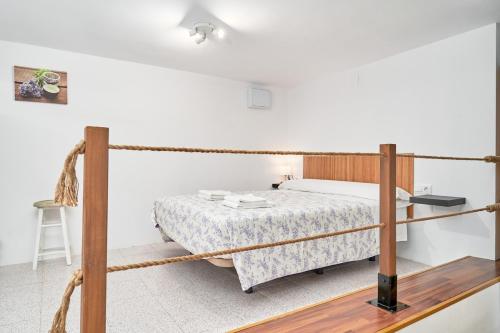 a bedroom with a bed with a rope around it at Calm Bungalow in Torrox