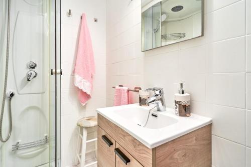 a bathroom with a sink and a shower at Calm Bungalow in Torrox