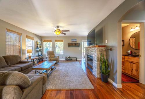 a living room with a couch and a fireplace at Adorable Remodeled Quiet Near Town Fenced Yard Pet Friendly 4353 in Hood River