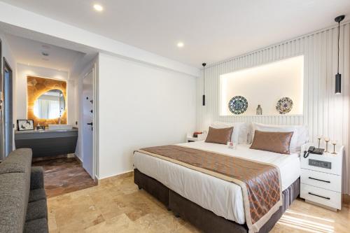 a bedroom with a large bed and a bathroom at BAB - by Menar Hotel in Istanbul