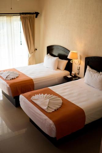 Cama ou camas em um quarto em Hotel Posada Sian Kaan Playa del Carmen